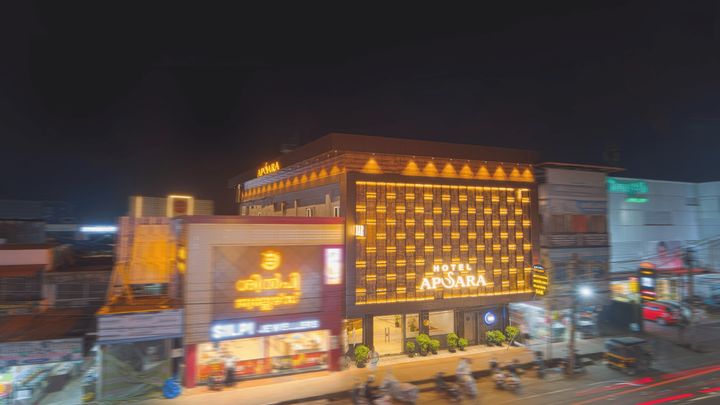 Hotel Apsara on the Old Highway at night, its facade lattice lit