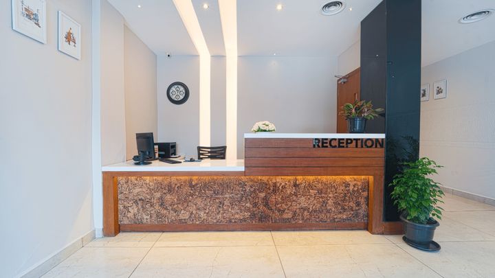 Reception desk with a carved stone counter
