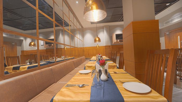 A long restaurant table set for a group
